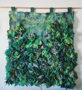 Green art piece with flowers
